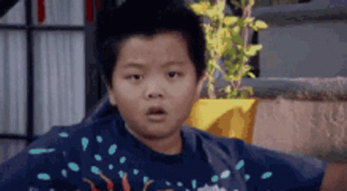 Boy in Blue Shirt Surprised
