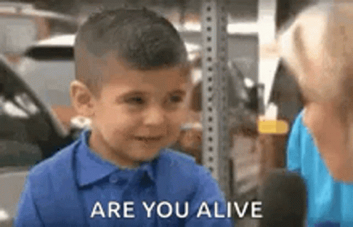 Boy in Blue Shirt Talking to Woman
