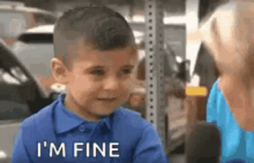 Boy in Blue Shirt Talking to Woman