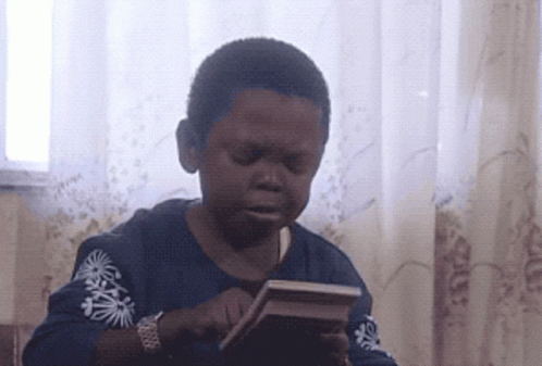 Boy in Blue Shirt with Palm Trees Holding Book