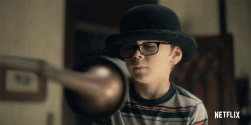 Boy in Bowler Hat and Glasses with Netflix Logo
