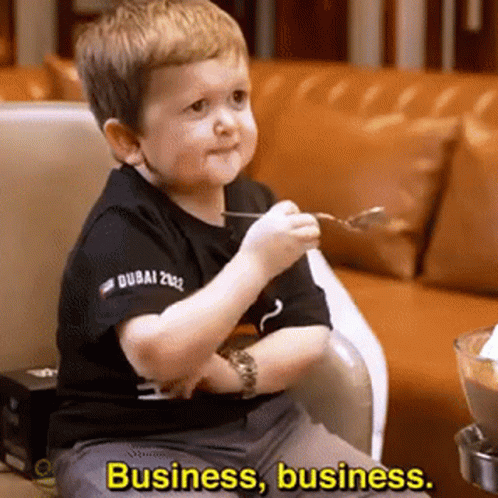 Boy in Chair With Spoon Saying Business Business