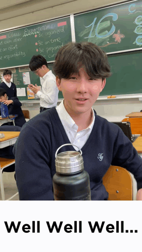 Boy in Classroom With Number 16