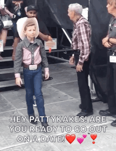 Boy in Cowboy Outfit Talking to Man in Plaid Shirt