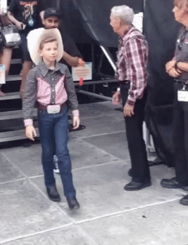 Boy in Cowboy Outfit Walking