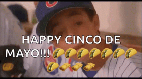 Boy in Cubs Hat Surrounded by Tacos