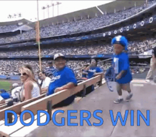 Boy in Dodgers Hat Walking