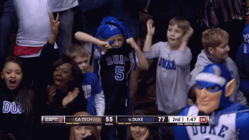 Boy in Duke Jersey Dancing in Stands