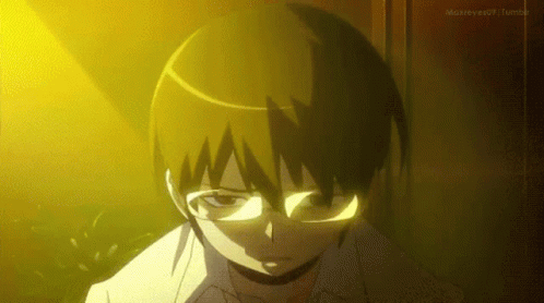 Boy In Glasses Standing Before Yellow Light GIF
