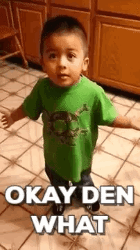 Boy in Green Shirt Making Funny Face