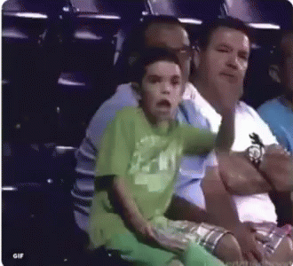 Boy In Green Shirt With Man At Stadium GIF