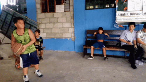 Boy in Green Under Armour Tank Top Holding Basketball