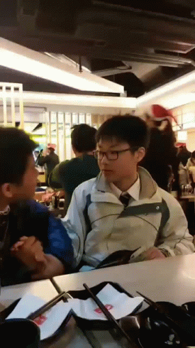 Boy in Jacket and Tie Talks to Another
