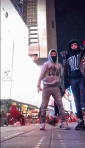 Boy In Jacket Sturdy Dances At Times Square GIF