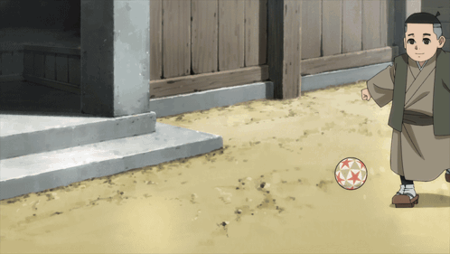 Boy in Kimono Kicking a Ball