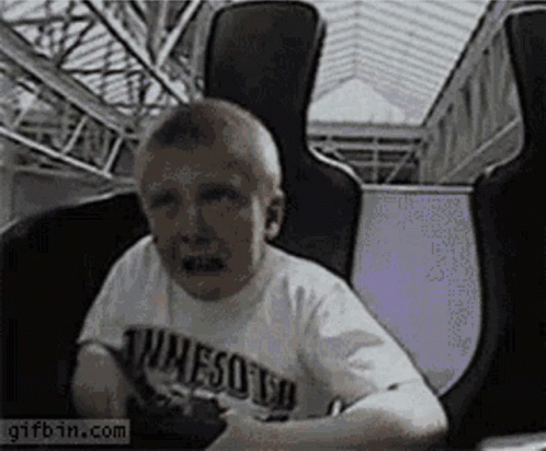 Boy In Minnesota T-Shirt Riding Roller Coaster GIF