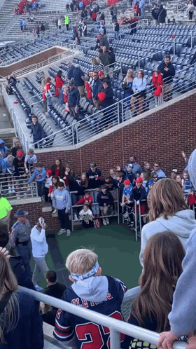 Boy in Number 24 Jersey in Crowded Stadium