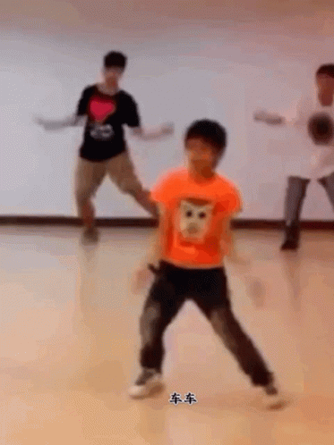 Boy in Orange Shirt With Monkey Face