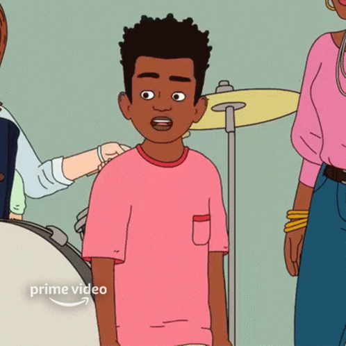 Boy in Pink Shirt Standing in Front of Drum Set
