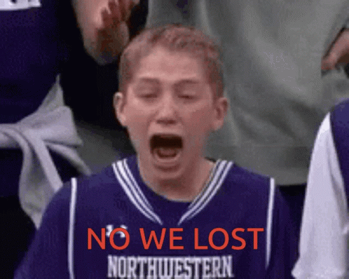 Boy in Purple Northwestern Jersey Screaming