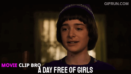 Boy in Purple Shirt and Headband Saying A Day Free Of Girls