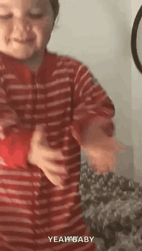 Boy in Red and White Striped Shirt Dancing