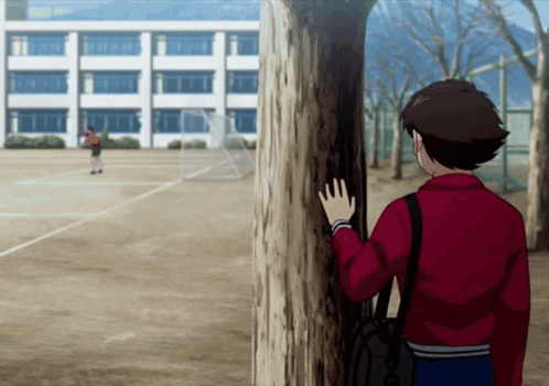 Boy in Red Jacket Next to School Wall
