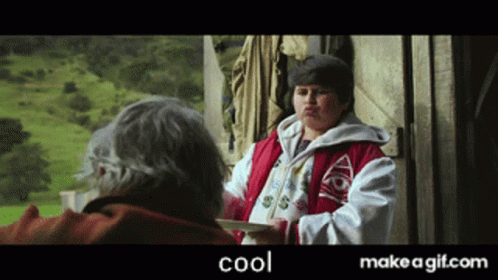 Boy In Red Jacket Talking To Older Man GIF