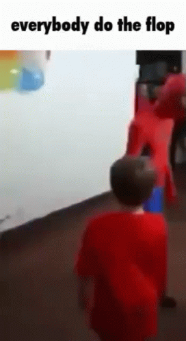 Boy in Red Shirt in Front of Group