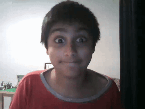 Boy in Red Shirt Making Funny Face