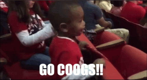 Boy in Red Shirt Says Go Coogs in Crowd
