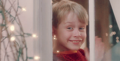 Boy in Red Sweater Smiling Out Window