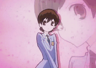 Boy In Suit And Tie In Front Of Pink Wall GIF