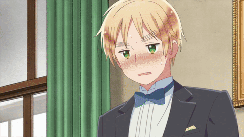 Boy in Tuxedo With Bow Tie Looking