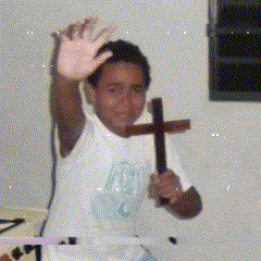 Boy in White Shirt Holding Cross
