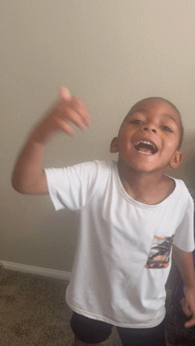Boy in White Shirt with Palm Tree Laughing