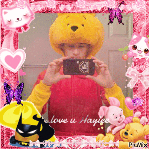 Boy in Winnie the Pooh Hat Taking Selfie in Pink Frame
