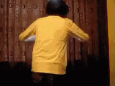 Boy in Yellow Shirt Dancing