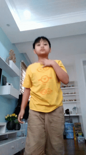Boy in Yellow Shirt Saying Go On