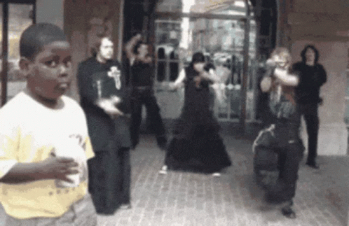 Boy In Yellow Shirt Watching People Dancing GIF