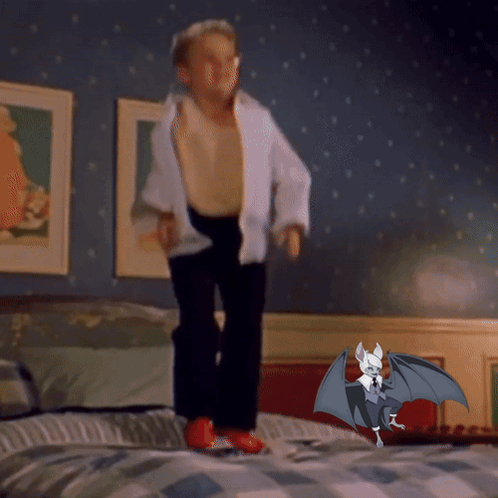 Boy Jumping On Bed Next To Bat With Wings GIF