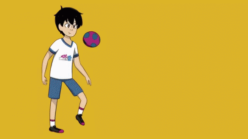 Boy Kicking Soccer Ball in Converse Shirt