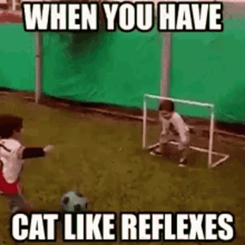 Boy Kicking Soccer Ball While Another Watches