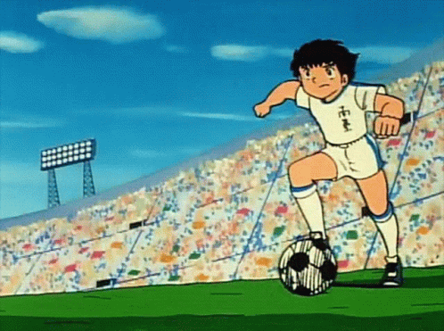 Boy Kicking Soccer Ball With Chinese Writing On Jersey GIF