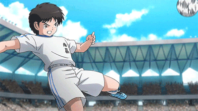 Boy Kicking Soccer Ball With Chinese Writing on Shirt