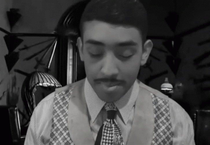 Boy Lighting And Smoking Cigar Grayscale GIF