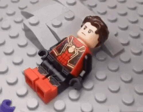 Boy Lying in Lego Bricks with Lego Sticker