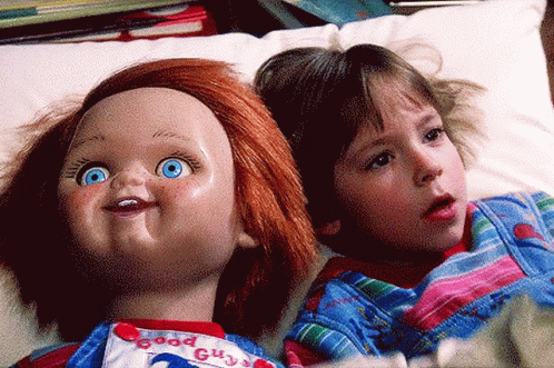 Boy On Bed With Picture Of Girl GIF