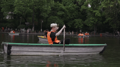 Boy Paddles Skiff Slowly GIF