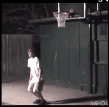 Boy Playing Basketball In Backyard At Night GIF